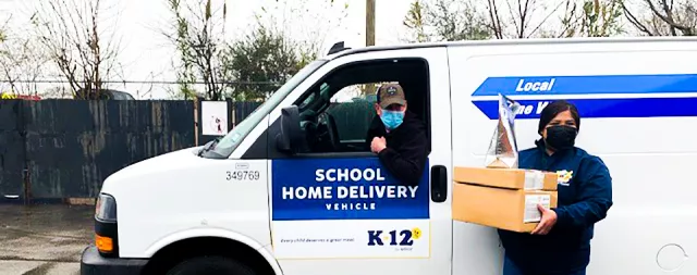 Delivery driver and employee delivering meals