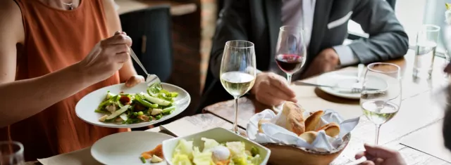 Group of people eating at restaurant